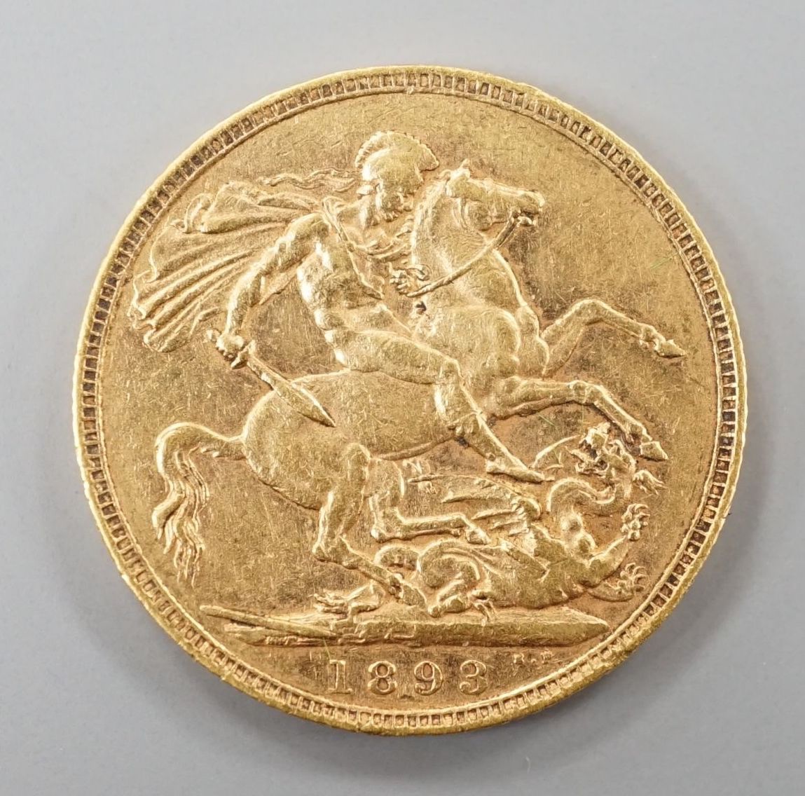 A Victoria 1893 gold sovereign.